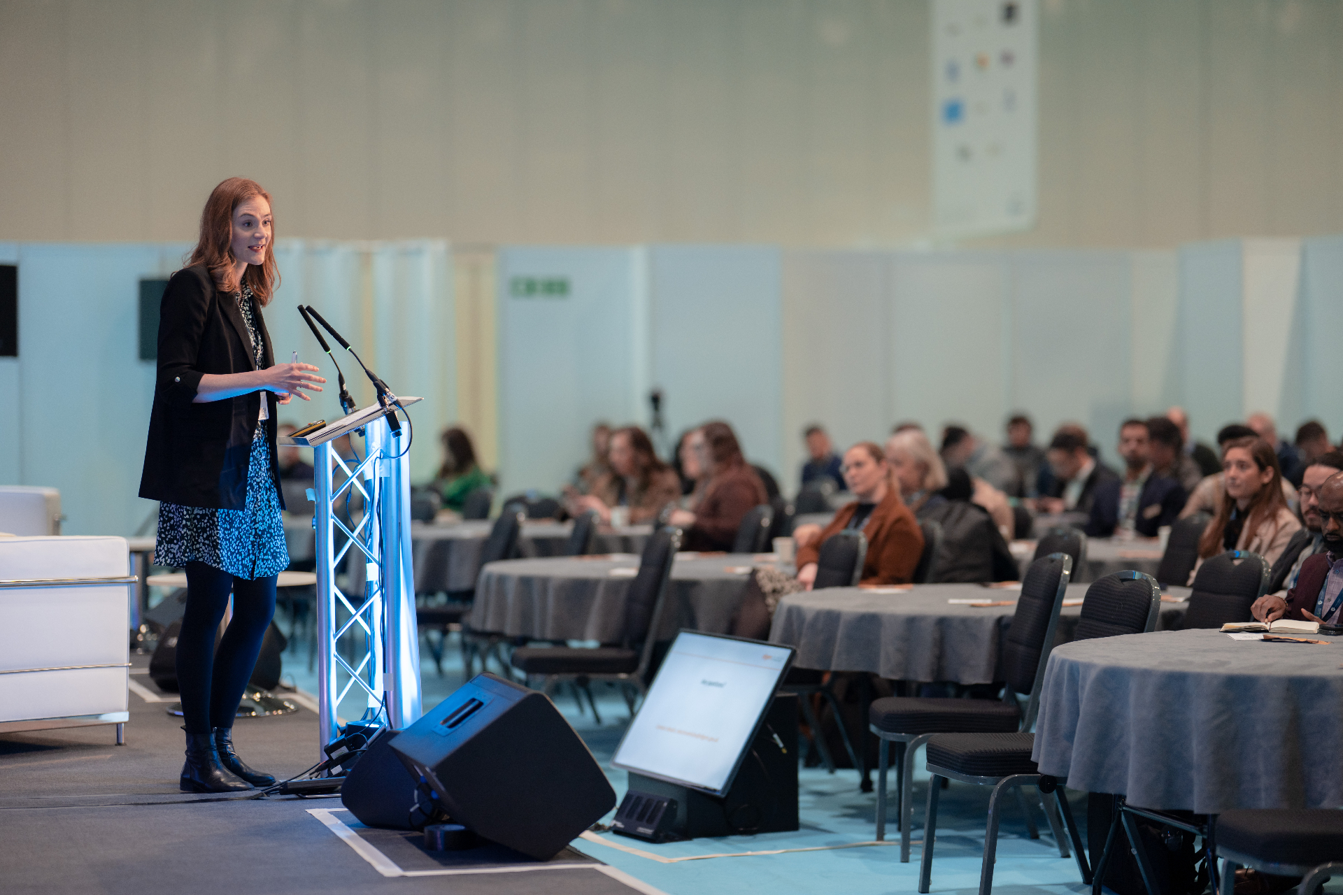 Conference speaker addressing an audience